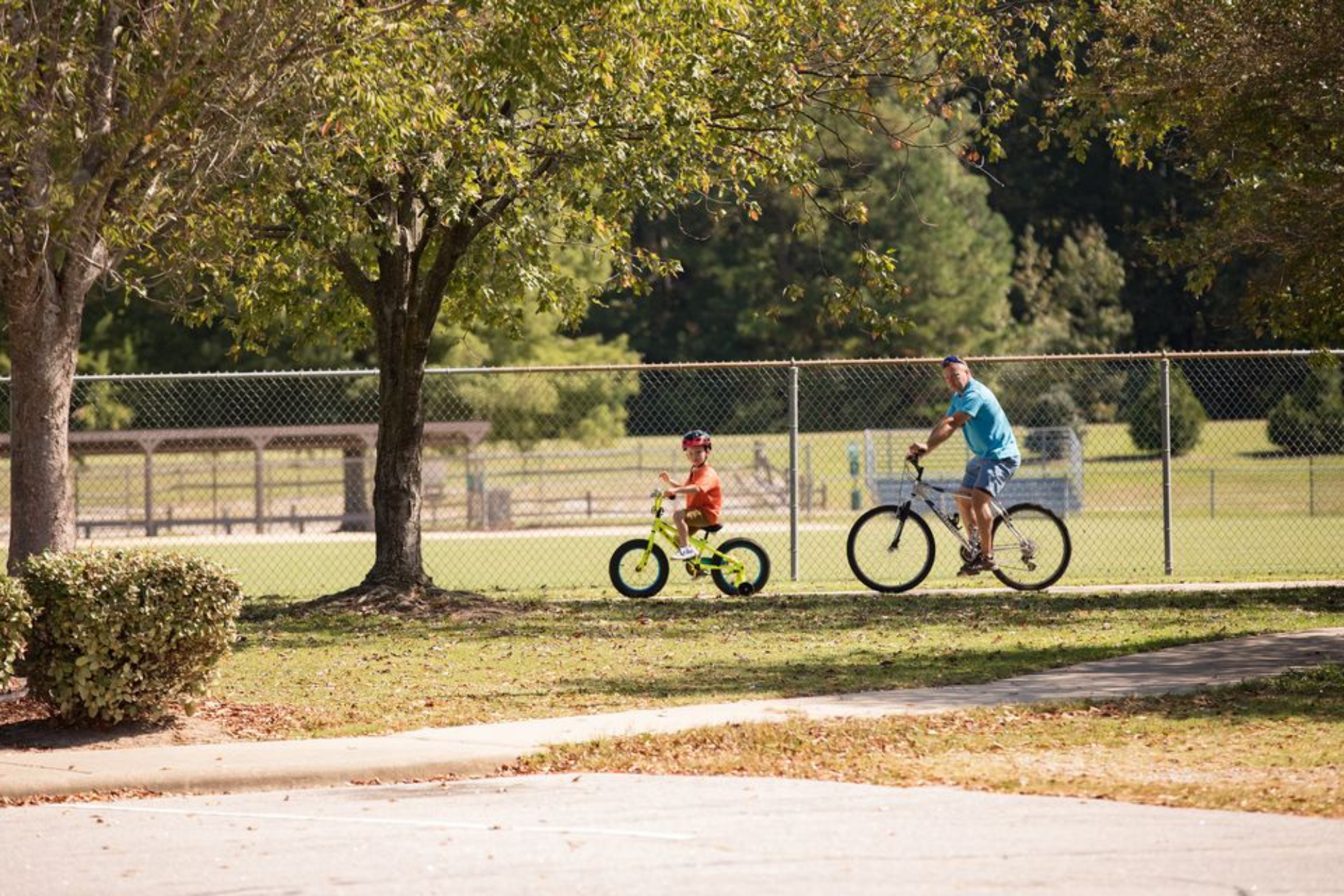 Two Residents Riding Bikes at Zebulon Community Park