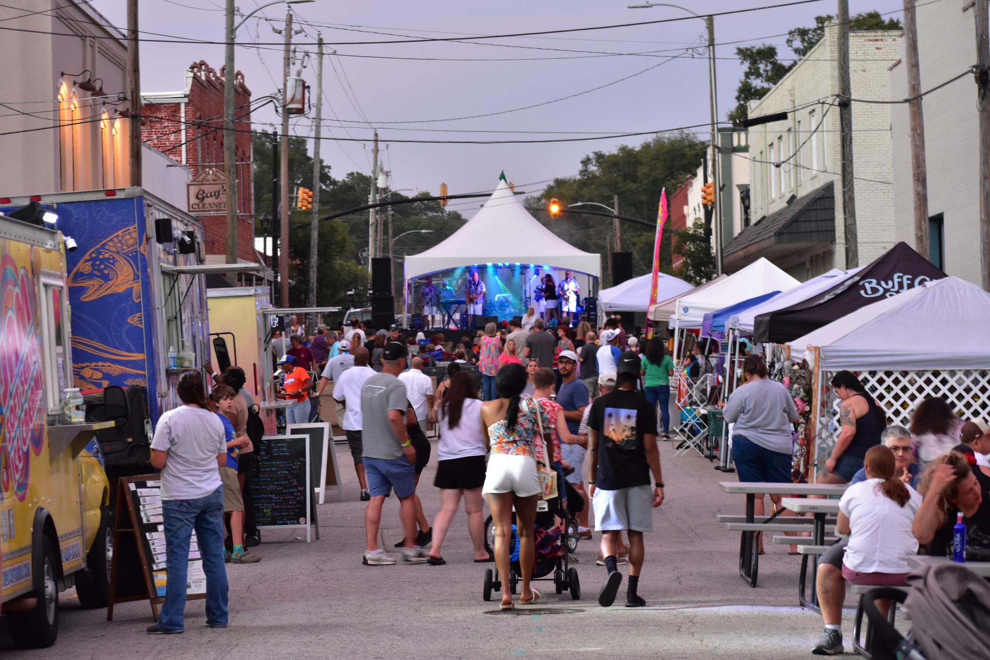 People walking around for Zebulon's Rock the Block event.