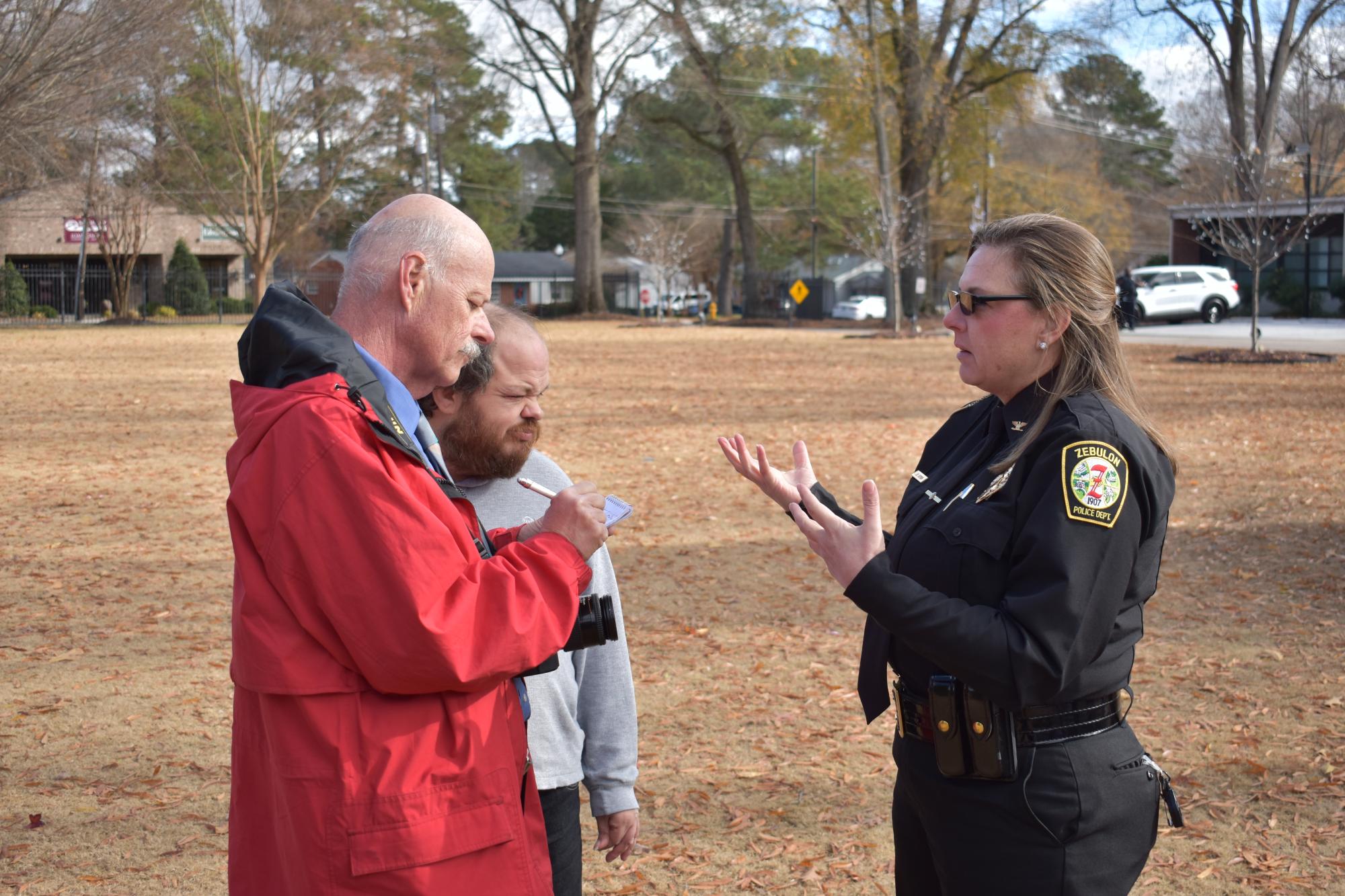 ZPD Police Chief speaking with members of the community.